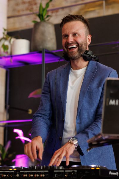 DJ at an event looking out into the crowd